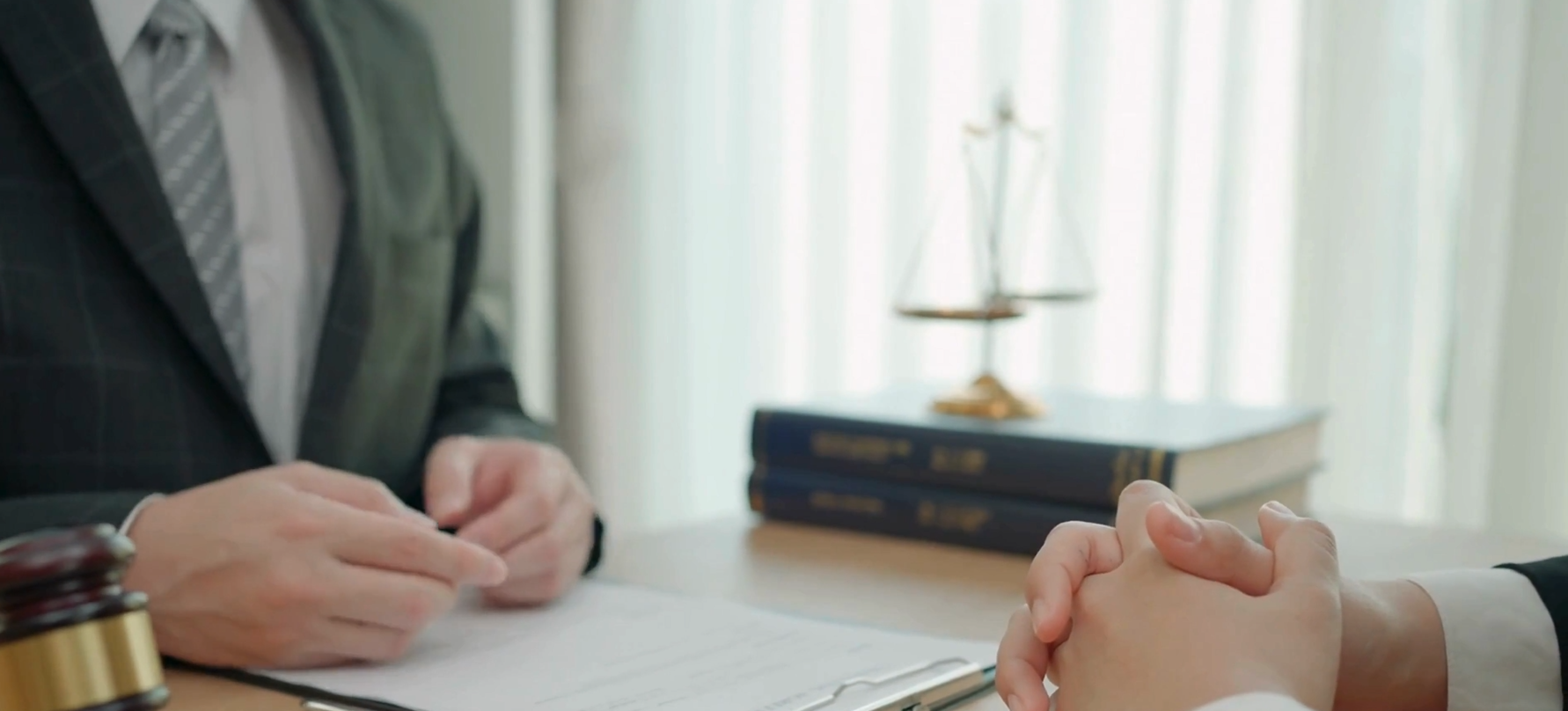 A man and woman are sitting at a table.